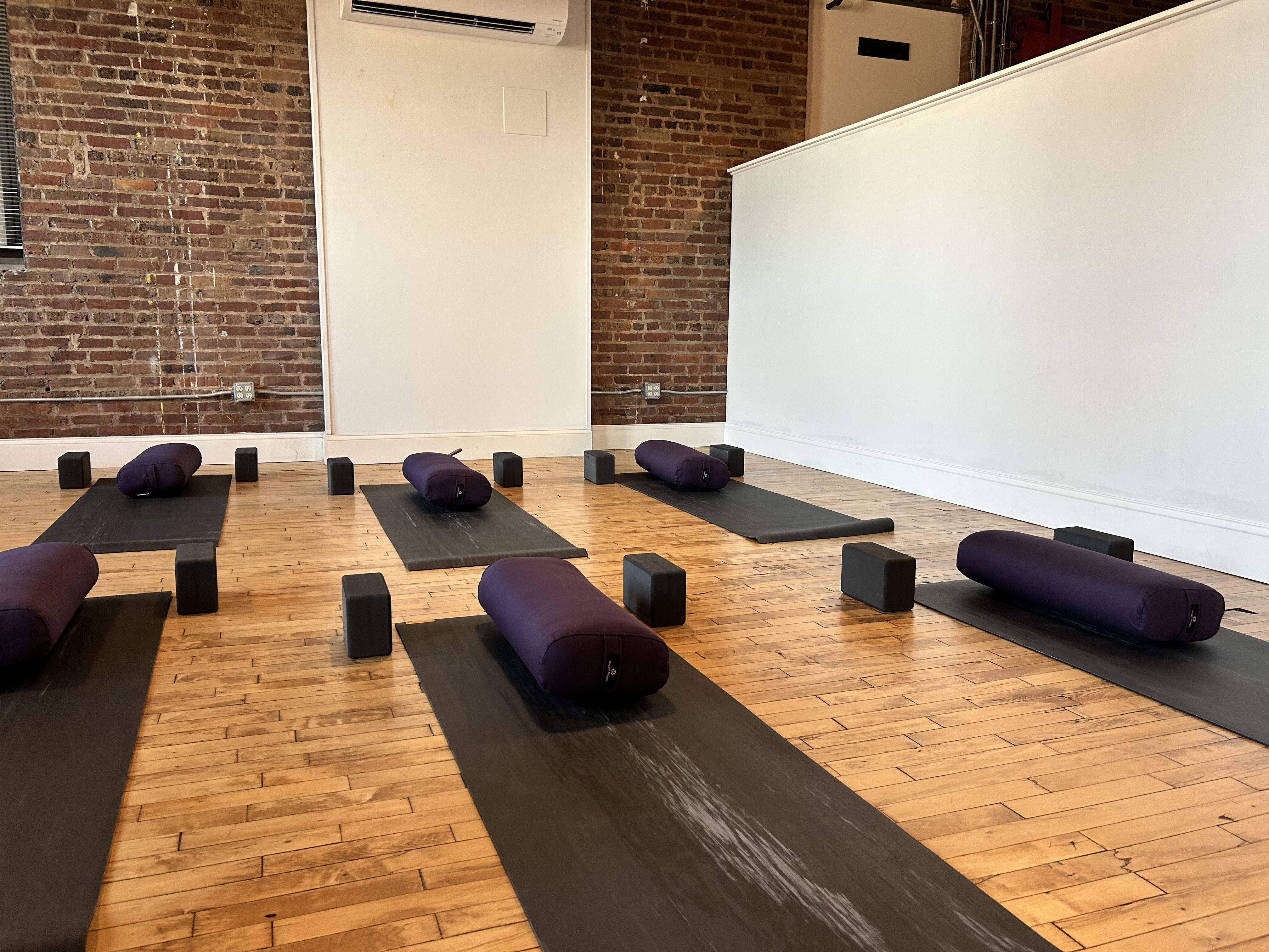 Yoga mats laid out inside Brewers Hill Yoga